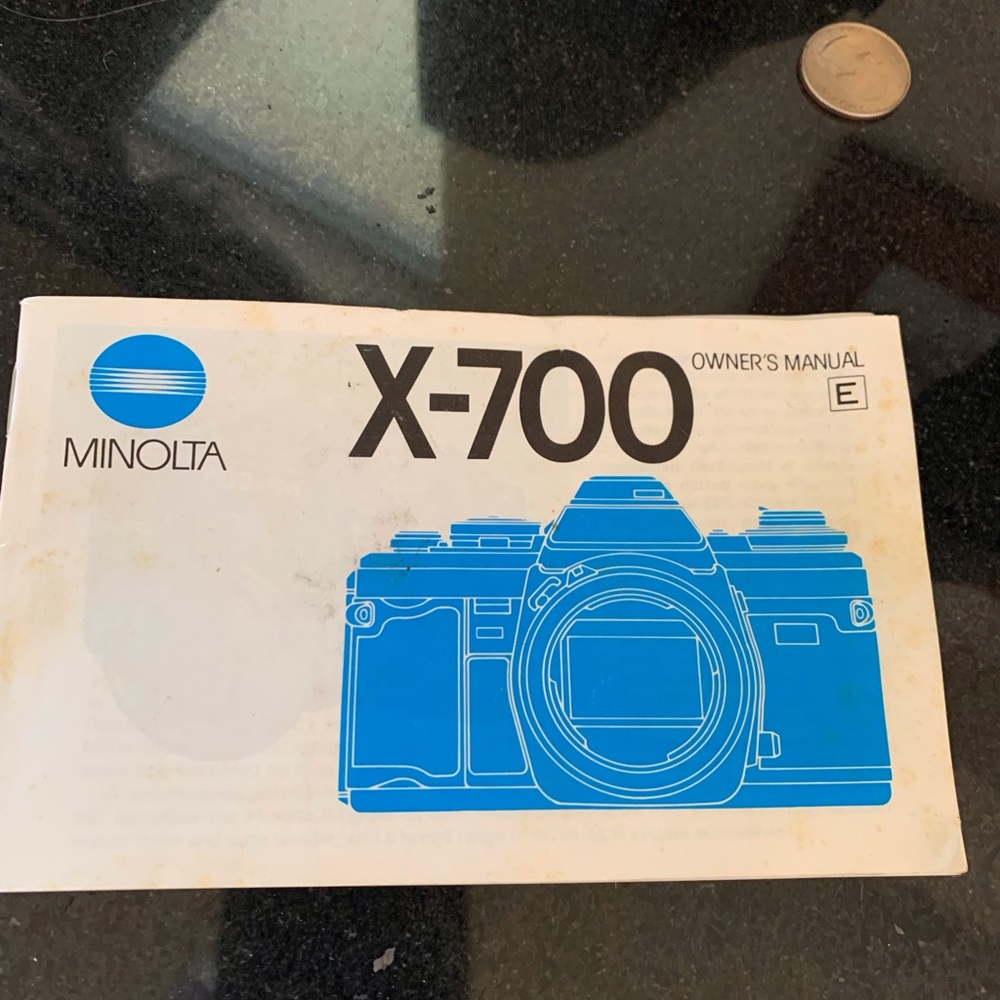 Minolta X-700 with Super Zoom Lenses, flash, etc. All paperwork.